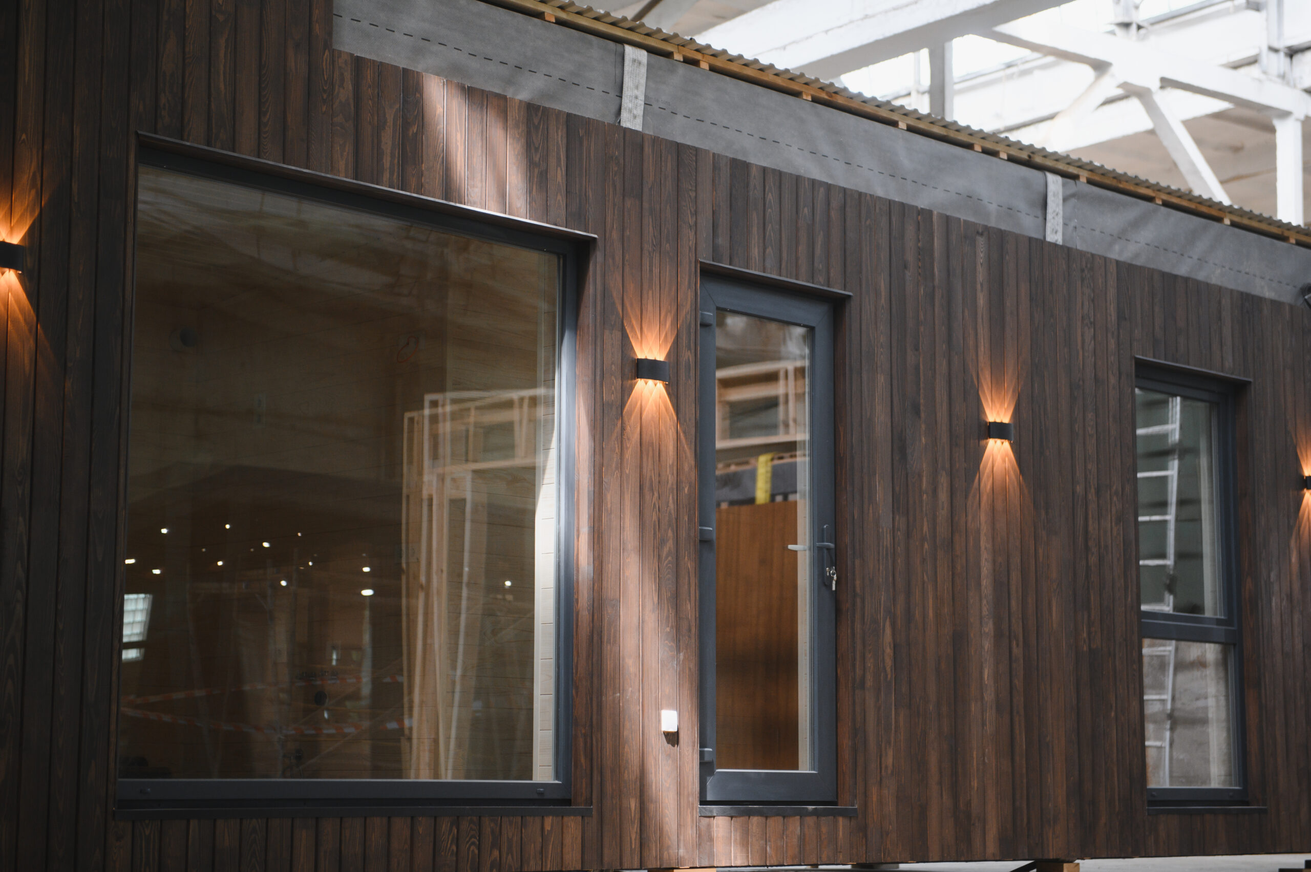 dark wooden solid wall panels with windows installed