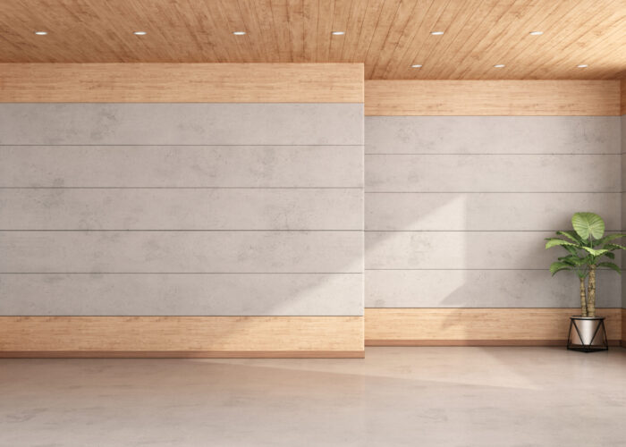 Empty room with concrete and wooden paneling solid wall panels with a mixed wooden and milky appearance